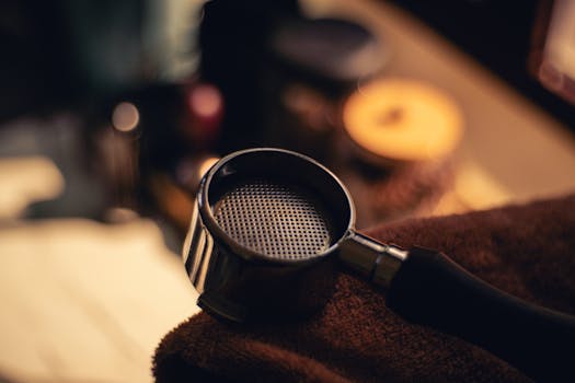 A close-up view of a coffee portafilter in a warm, inviting setting.