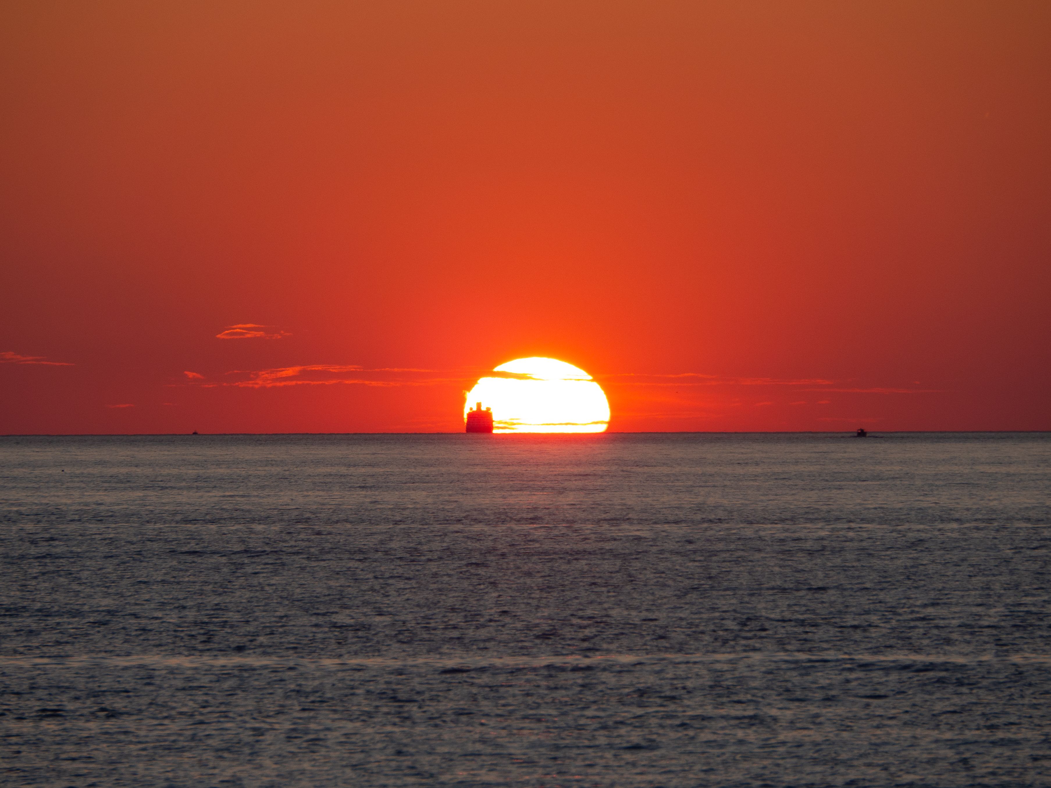 Sunset at Sea with Silhouette of Ship · Free Stock Photo