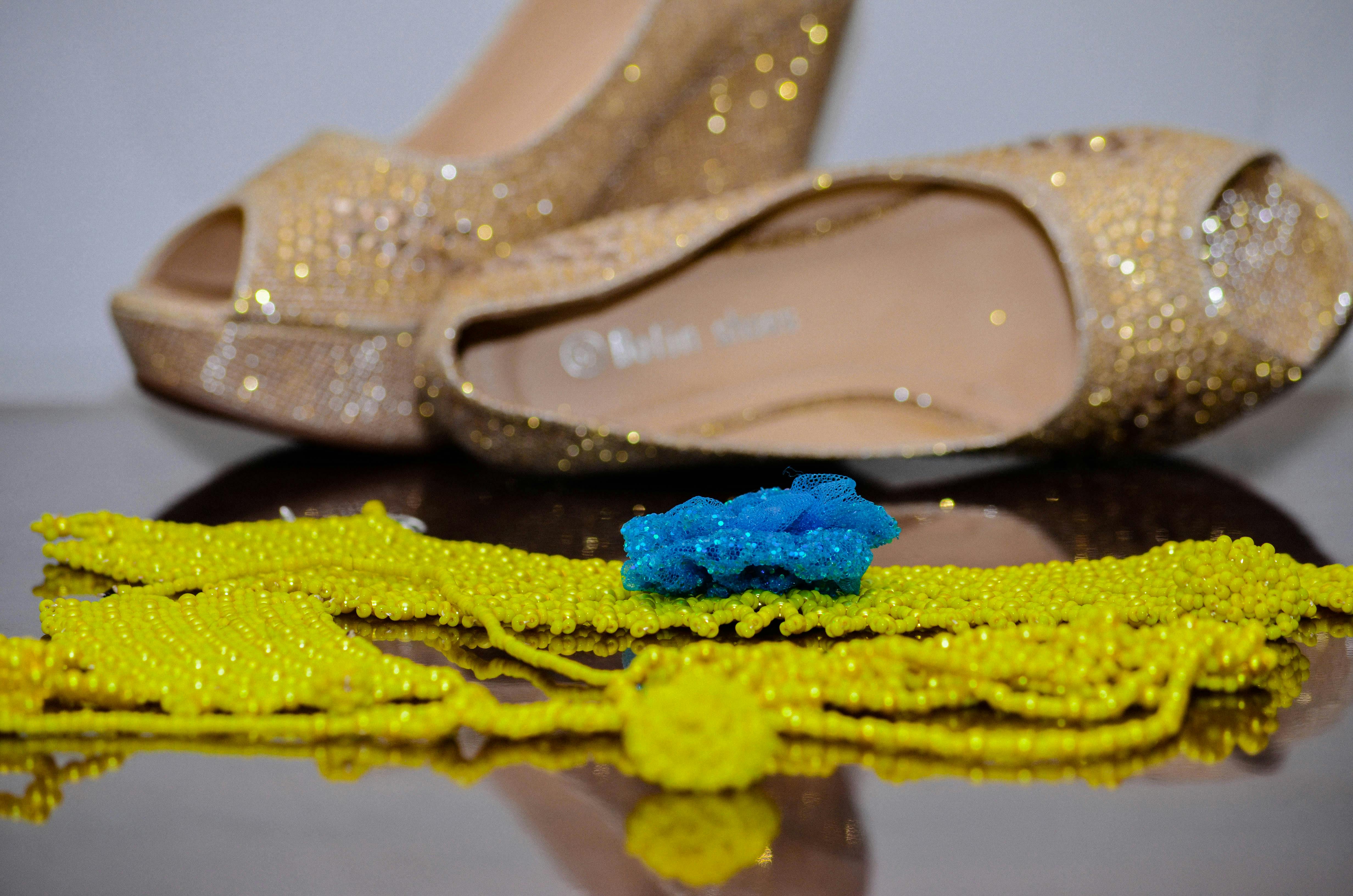 Free stock photo of beads, footwear, golden