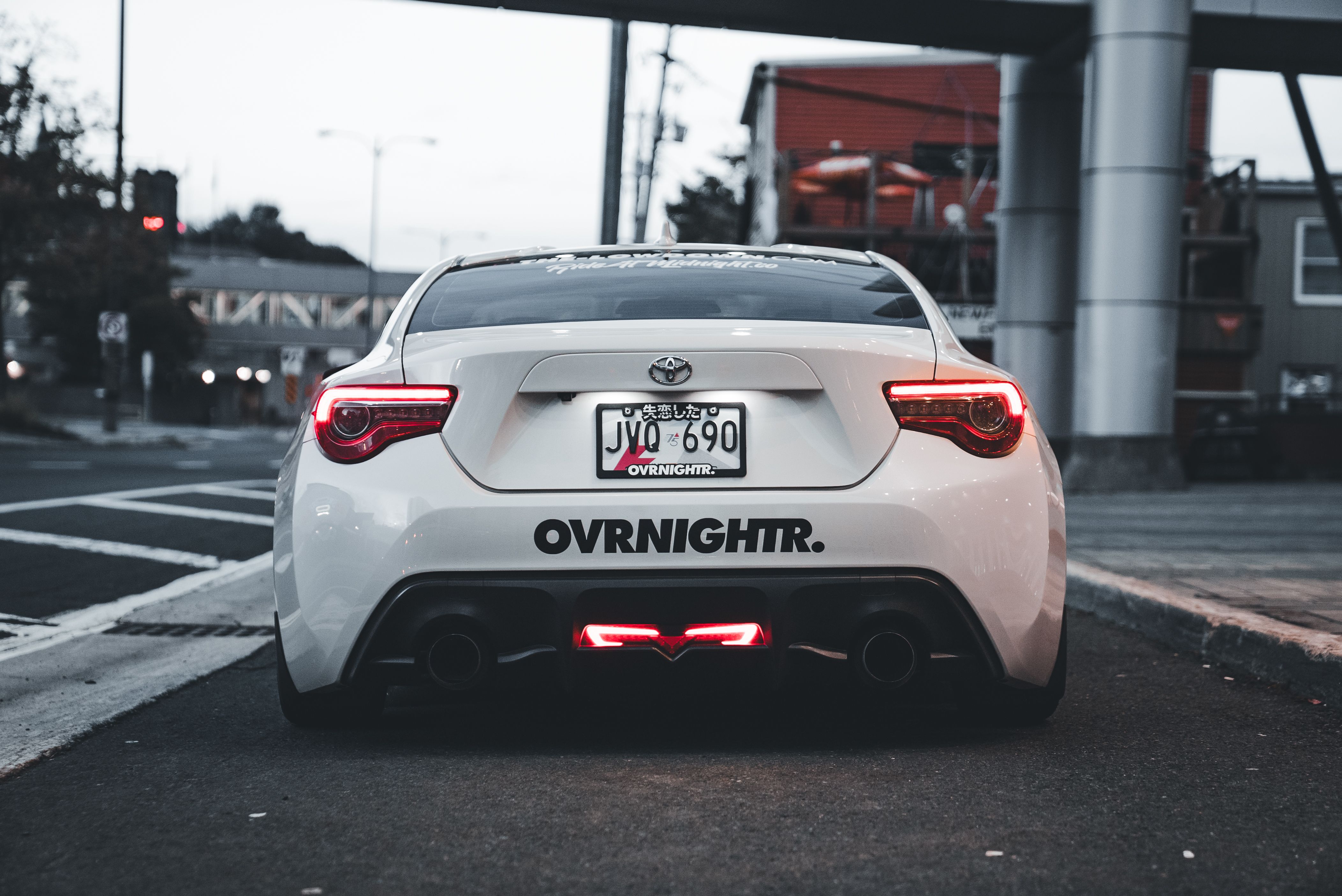 Street Scene with Modified Sports Car at Dusk · Free Stock Photo