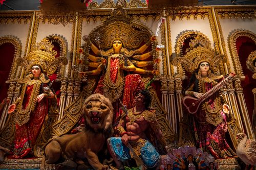 Free Colorful Durga Puja idol with detailed craftsmanship, depicting Hindu goddess and deities. Stock Photo