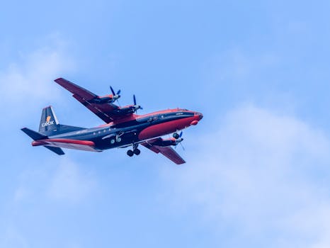 A Cavok An-12 cargo plane soaring through clear skies over Sofia, Bulgaria.