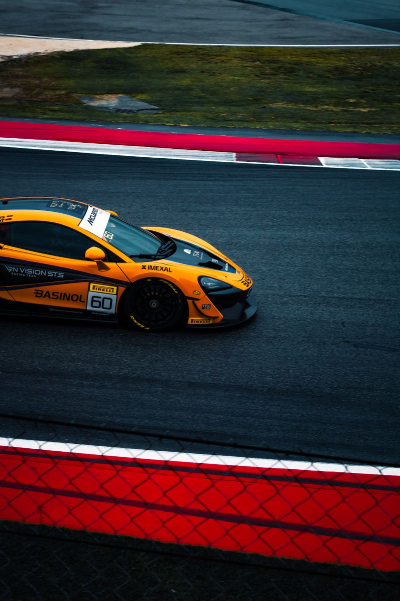 Performance car on track showing handling capability after suspension upgrade
