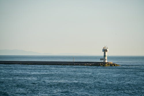 White Lighthouse Beside Ocean