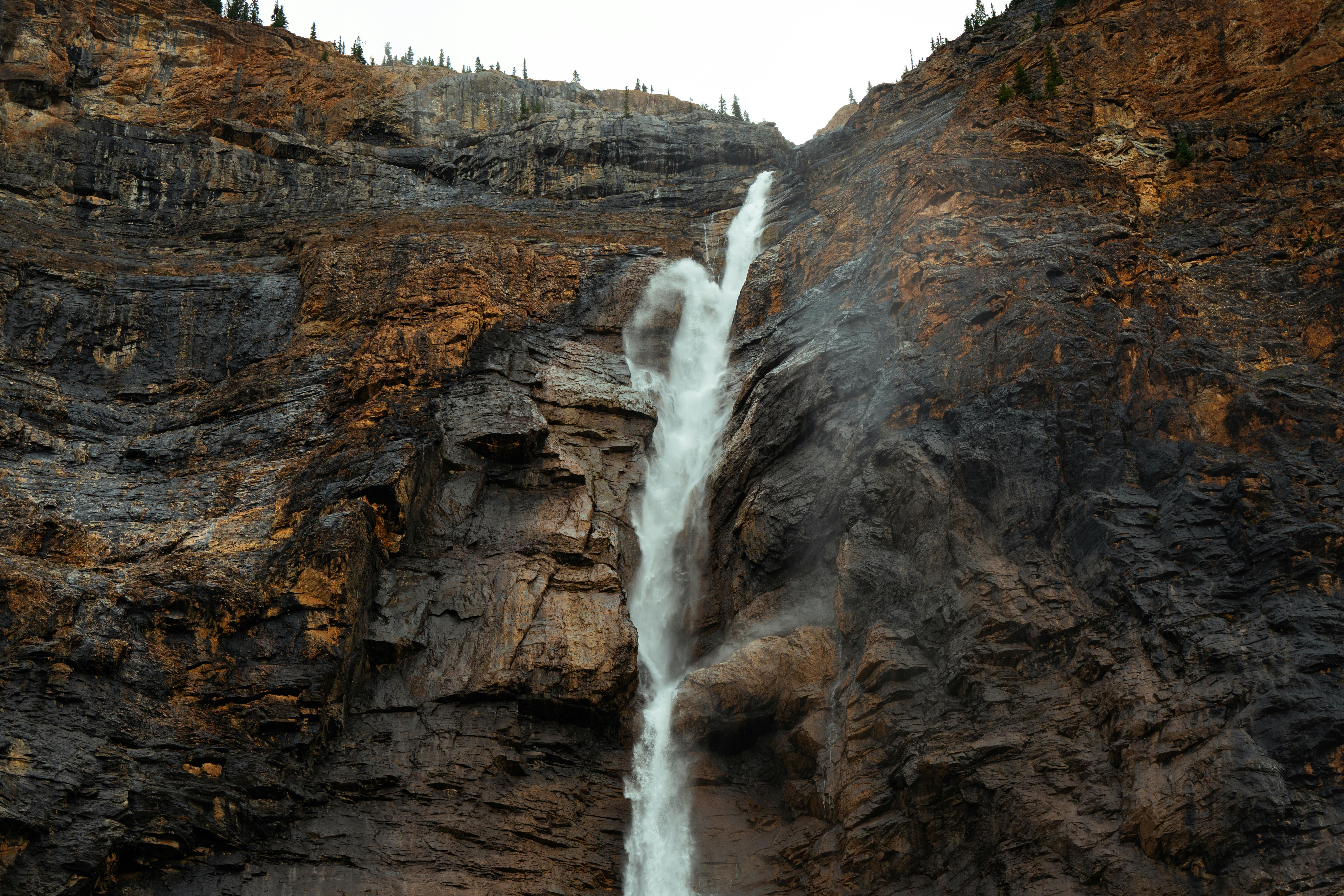 majestic waterfall cascading down rocky cliff