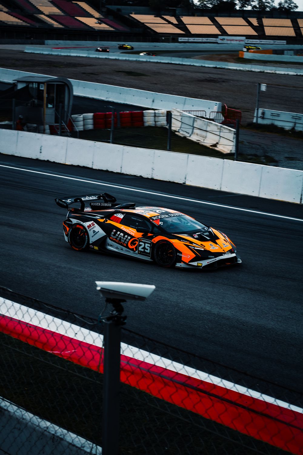 High With Cars Racing High-Speed Racing Car on Track at Dusk · Free Stock Photo