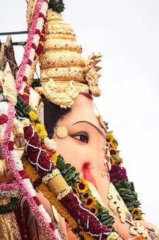 Beautifully adorned Ganesh idol with flowers during Ganesh Chaturthi festival in Mumbai, India.
