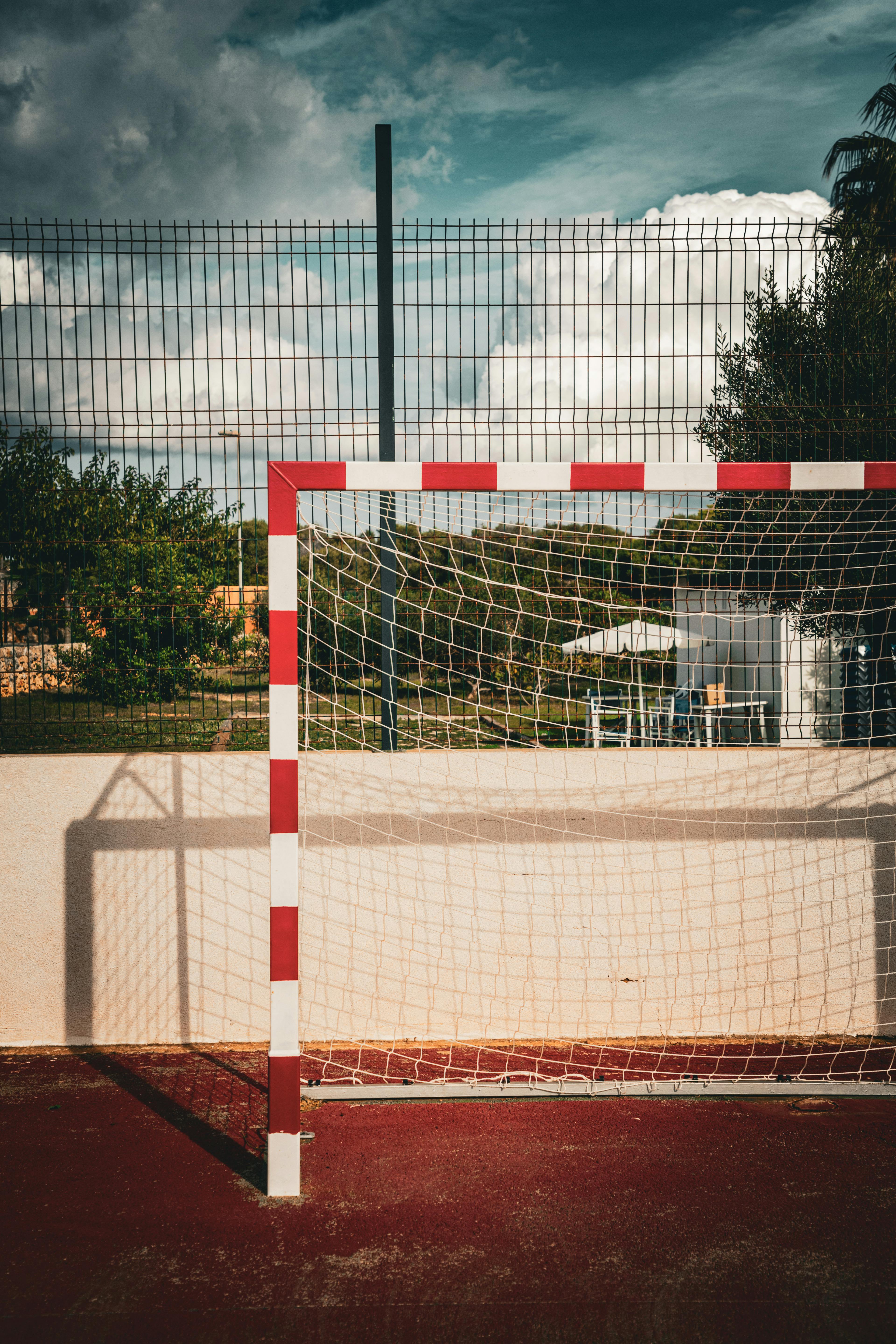 outdoor sports field with red and white goal post