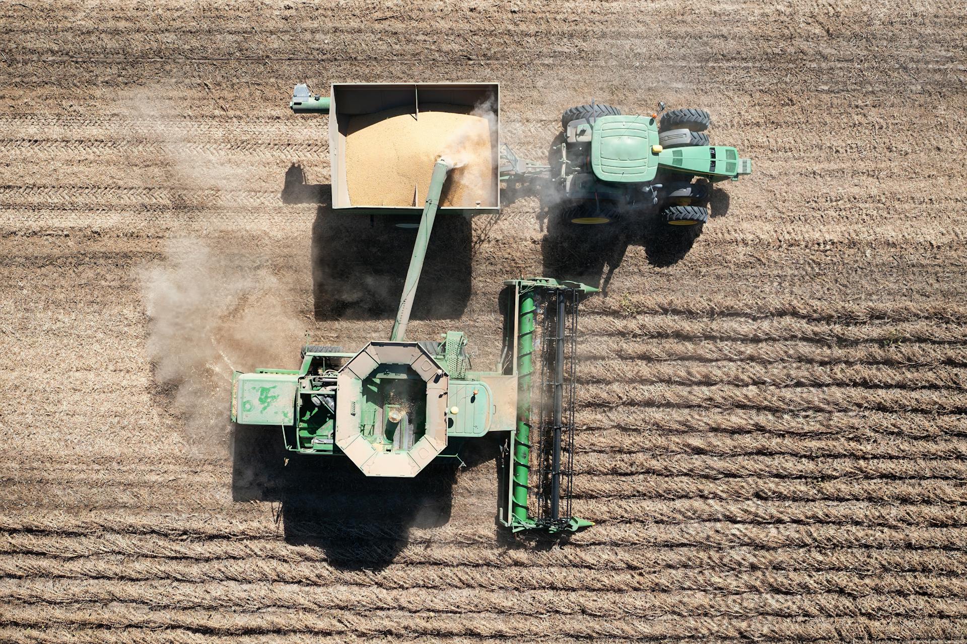 Aerial shot of farming machinery harvesting crops in West Albany, Minnesota.