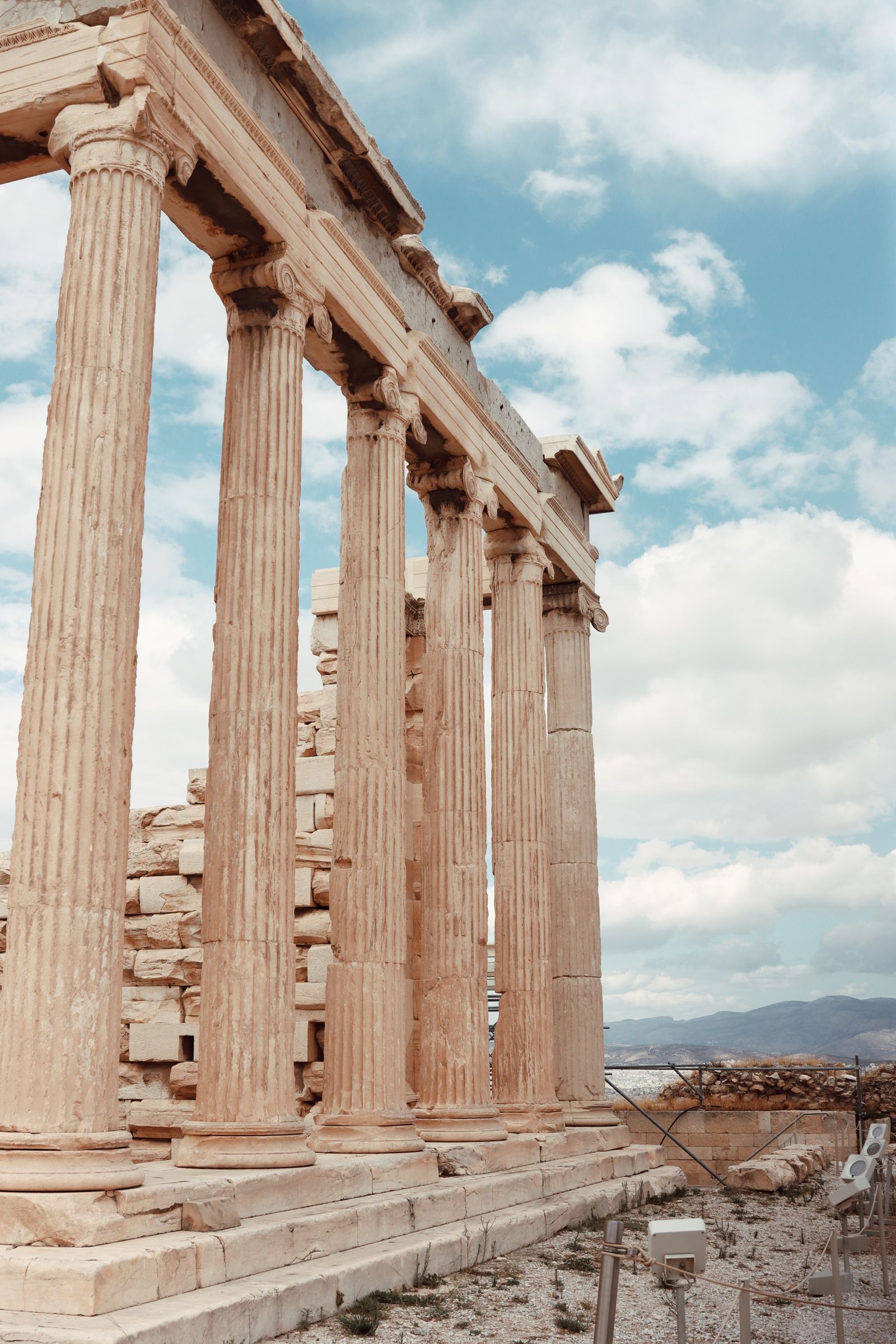 Parthenon columns against a clear blue sky at the top of the Acropolis