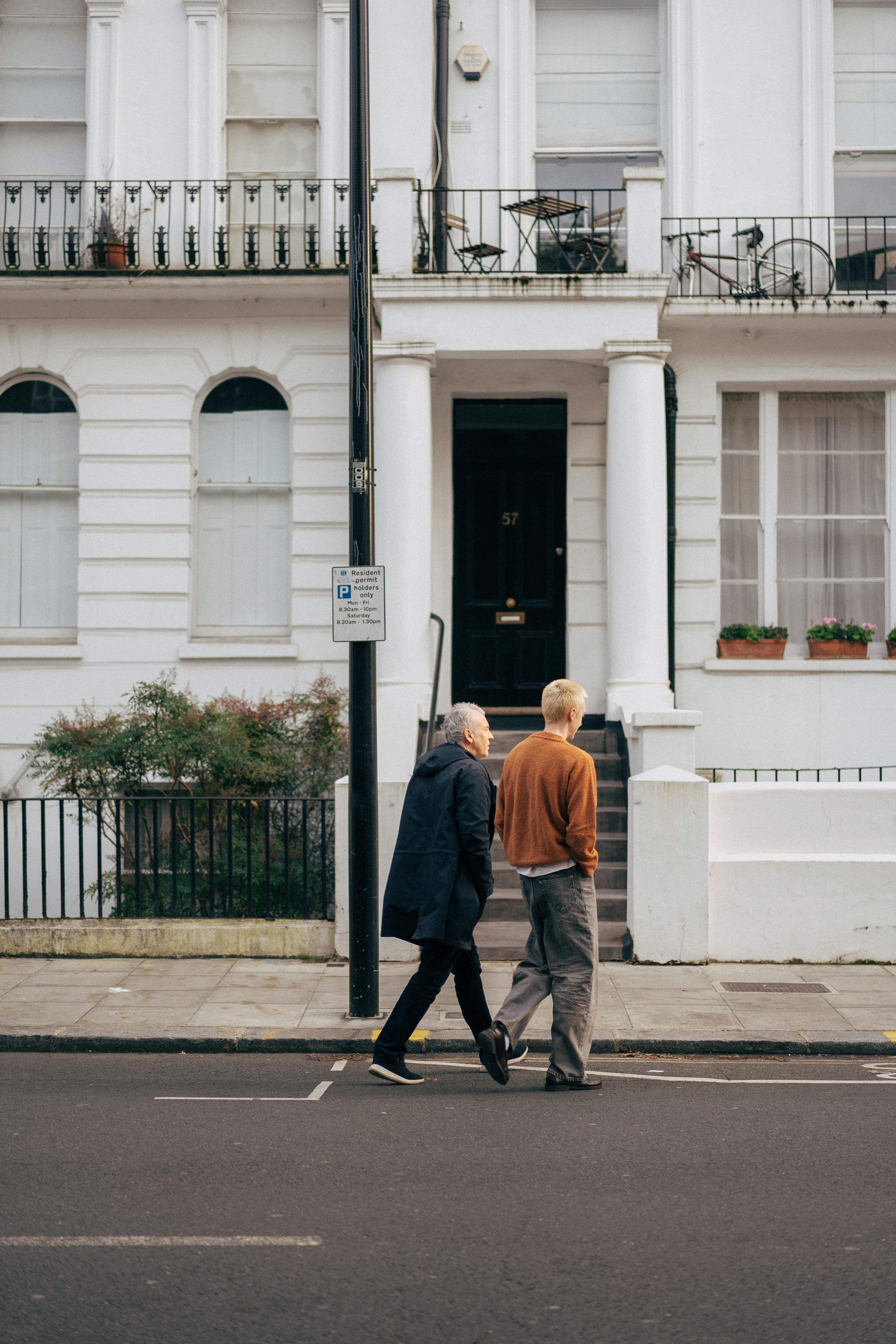 elderly couple walking in london neighborhood