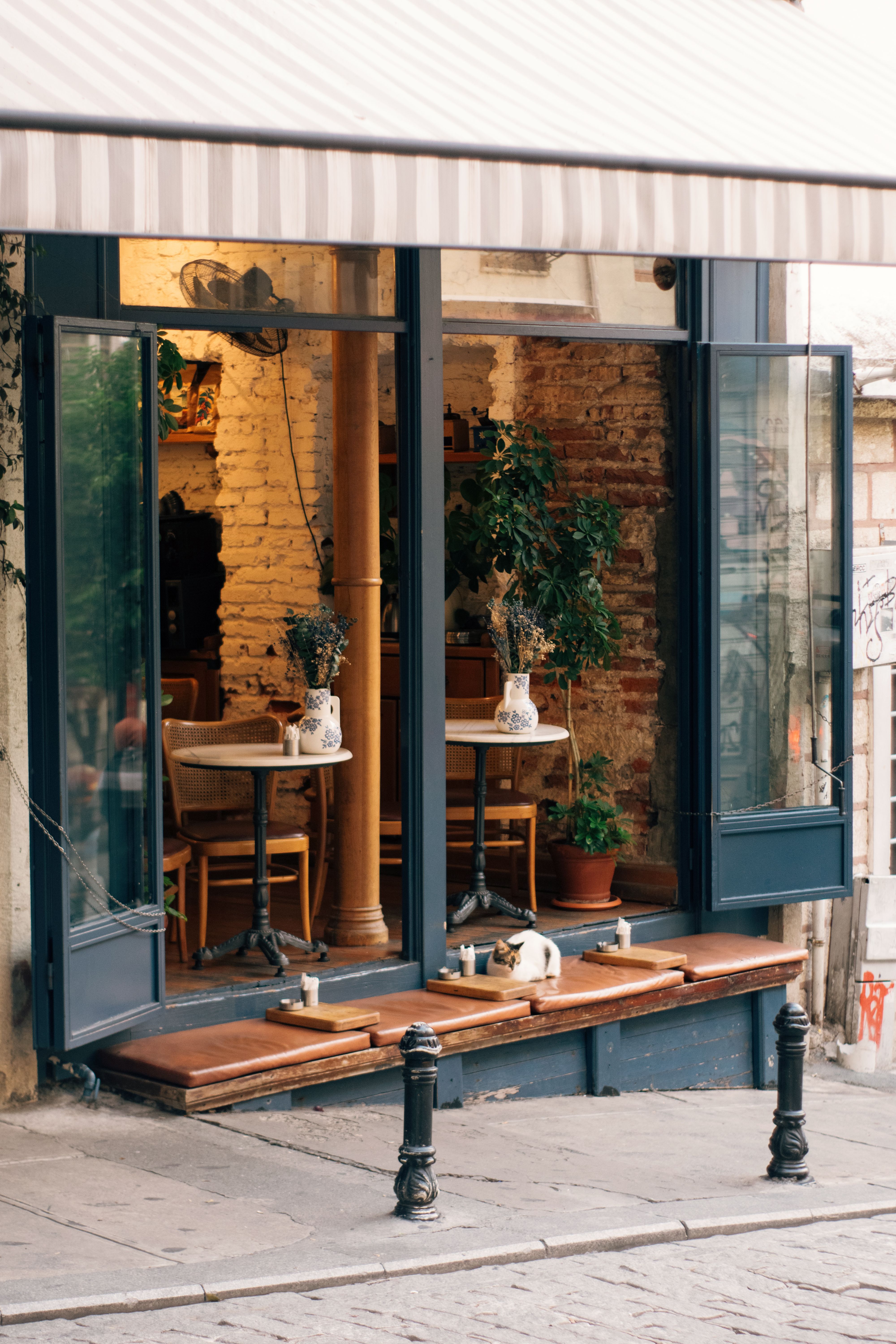 Charming Outdoor Cafe with Open Windows · Free Stock Photo