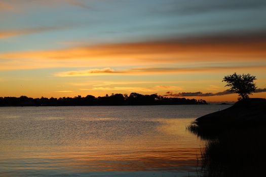 Breathtaking sunrise over the serene Cove Island Park waters in Stamford, Connecticut.