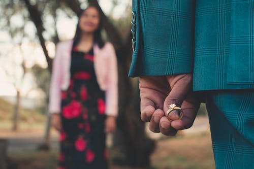 Person Holding Diamond Ring