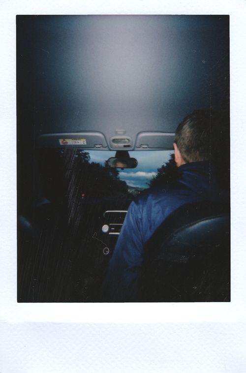 Free A candid rear view image of a driver inside a car, capturing the windshield view. Stock Photo