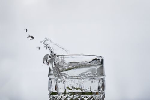 Free Crystal-clear water splashing in a glass captured in stunning detail. Stock Photo