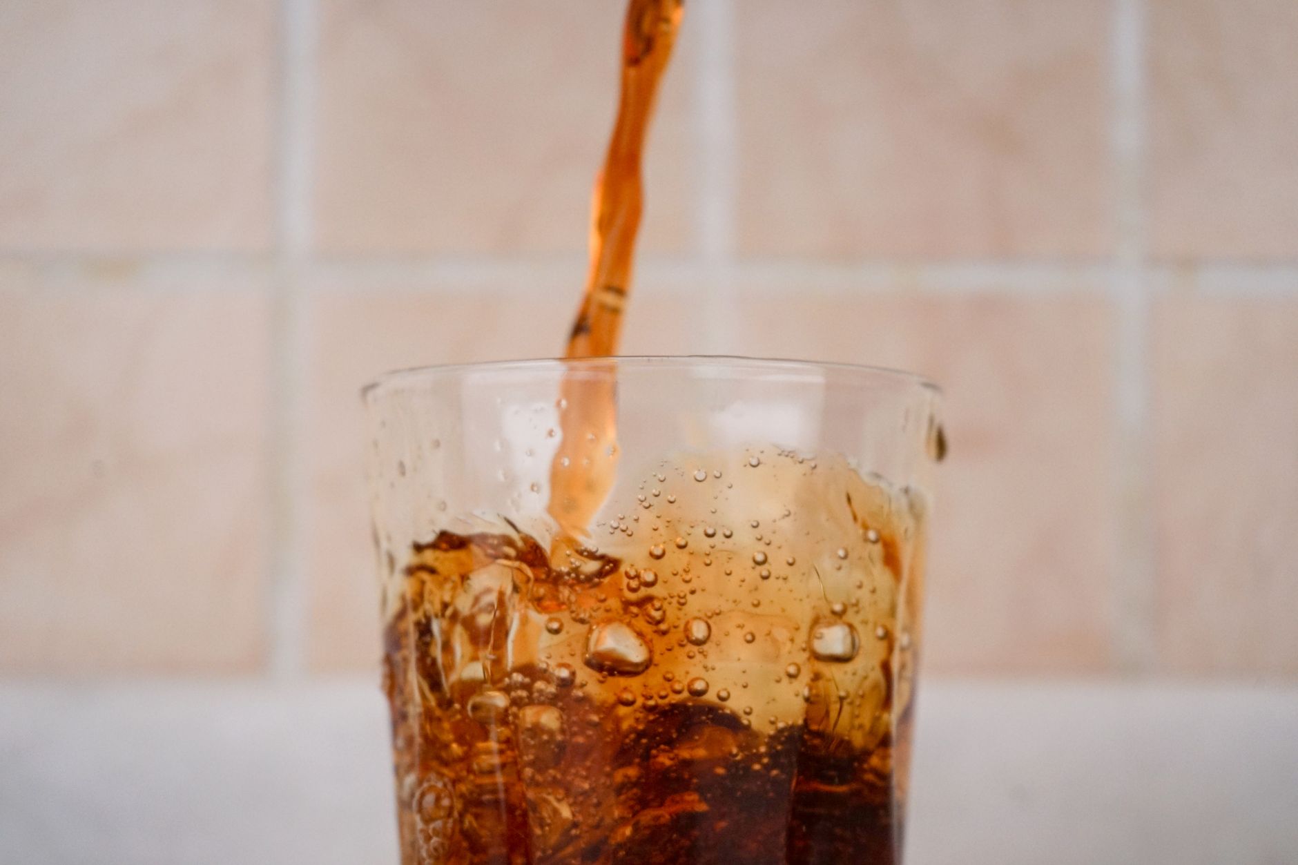 Refreshing chilled cans of sparkling caffeinated water on ice