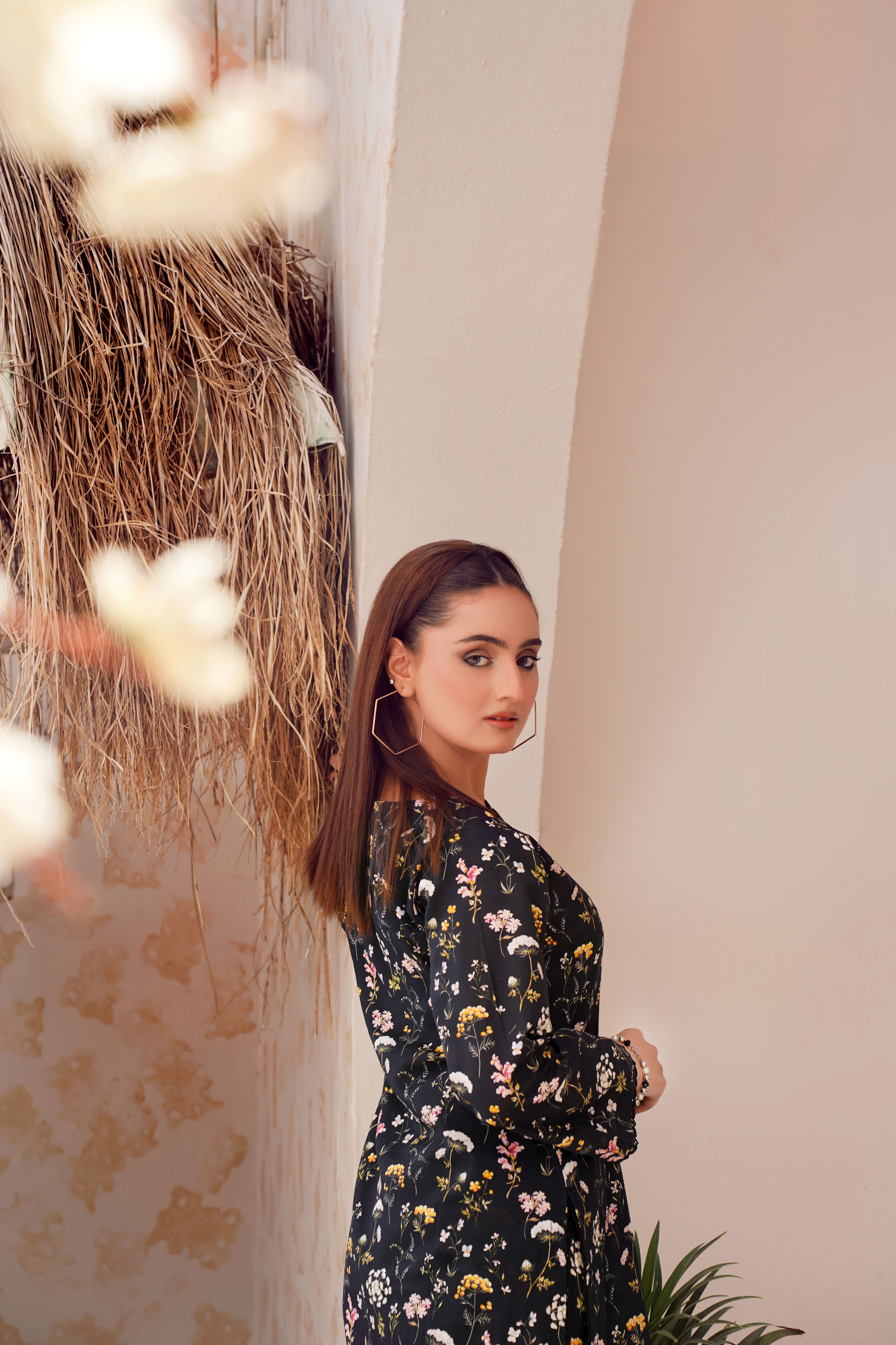 Elegant Woman in Floral Dress Posing Indoors · Free Stock Photo