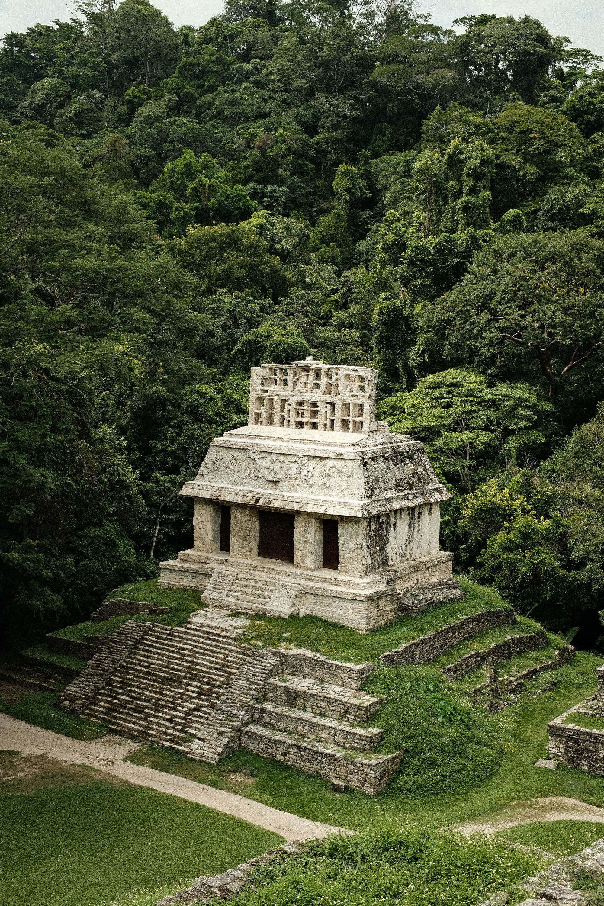 Maya temple surrounded by lush jungle, the quieter side of Yucatán archaeological sites