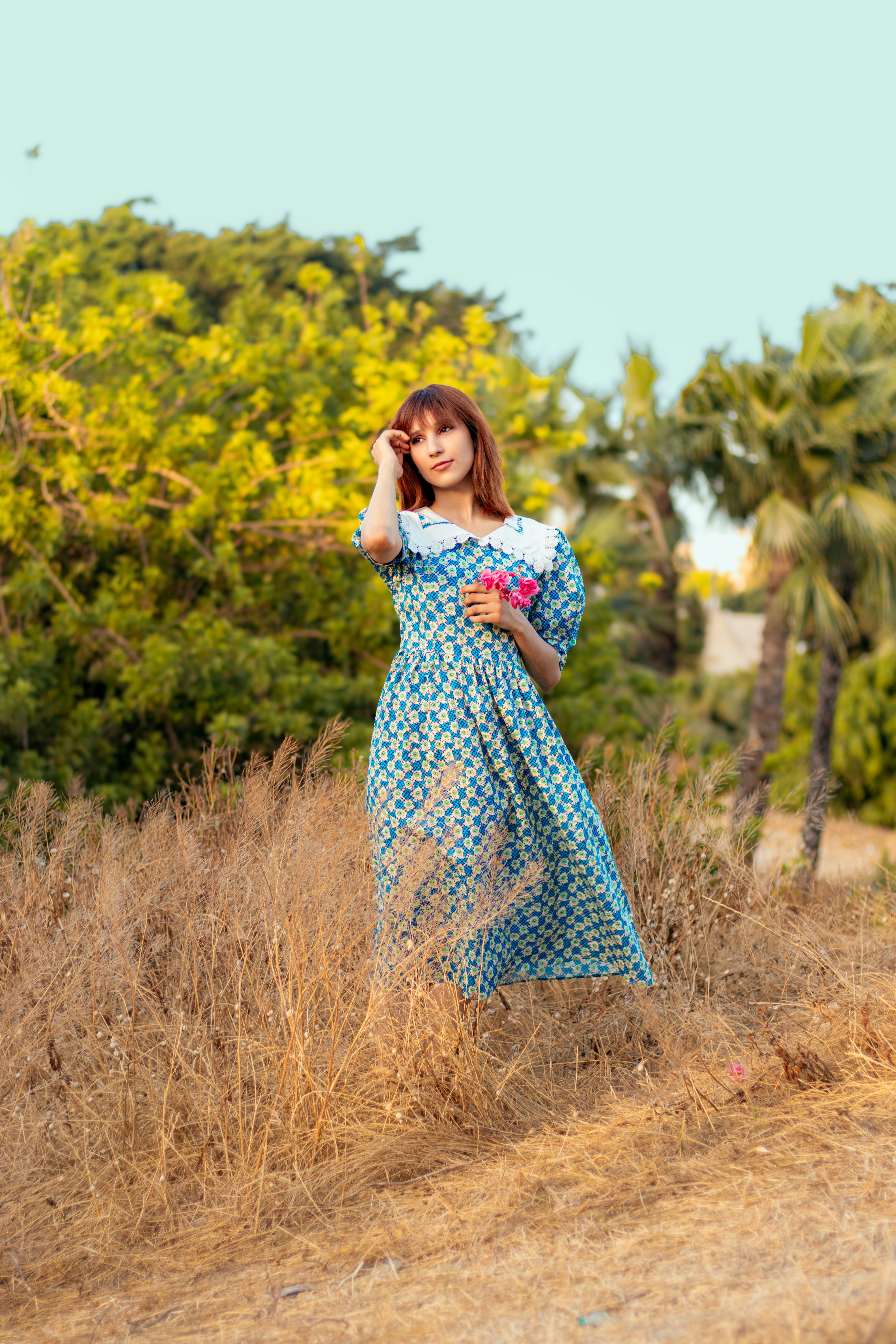 Woman in Floral Dress with Flowers Outdoors · Free Stock Photo