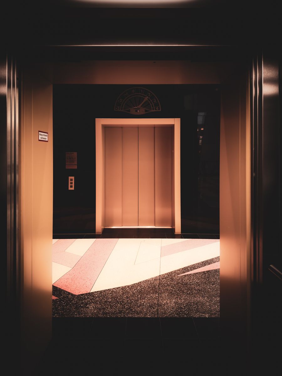 Commercial passenger elevator landing entrance doors