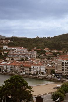 Picturesque coastal landscape of Baiona in northern Spain with historic architecture.