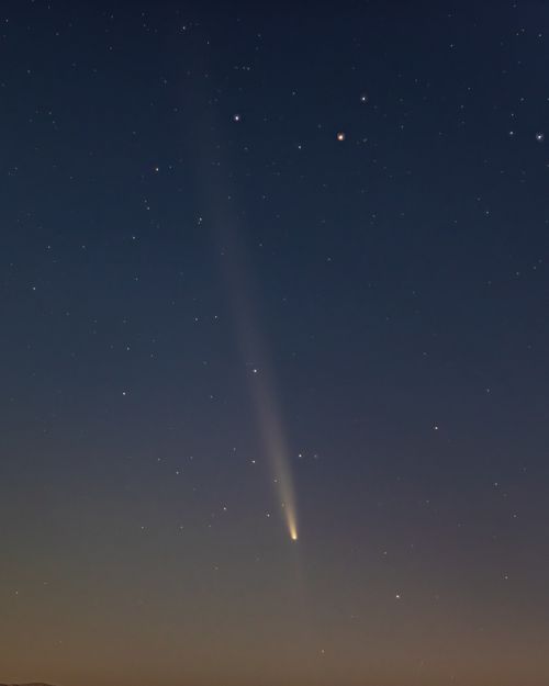 Free A stunning view of a comet streaking across the starry sky over Merzifon, Amasya, Türkiye. Stock Photo