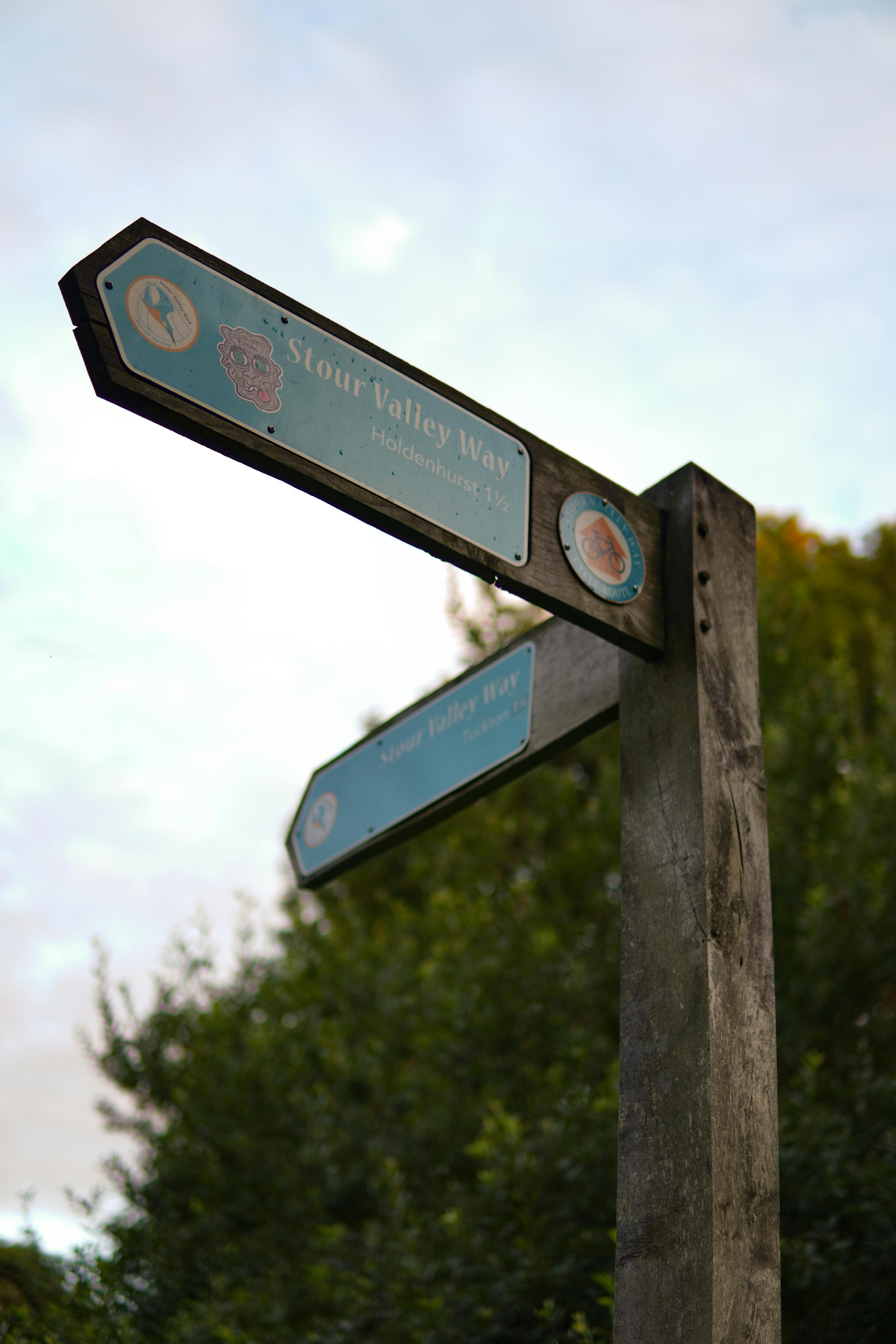 A rustic wooden signpost marking the Stour Valley Way hiking trail.