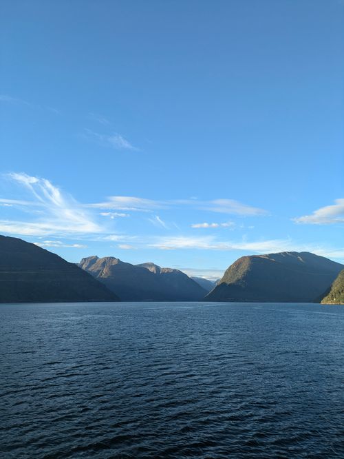 Free Breathtaking fjord landscape in Northern Norway with serene waters and clear sky. Stock Photo