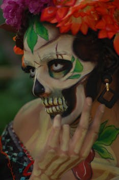 Striking Dia de los Muertos makeup with vibrant flowers and artistic design in Mexico City.