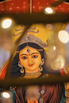 Close-up of a beautifully adorned Goddess Durga idol in Kolkata during Durga Puja.