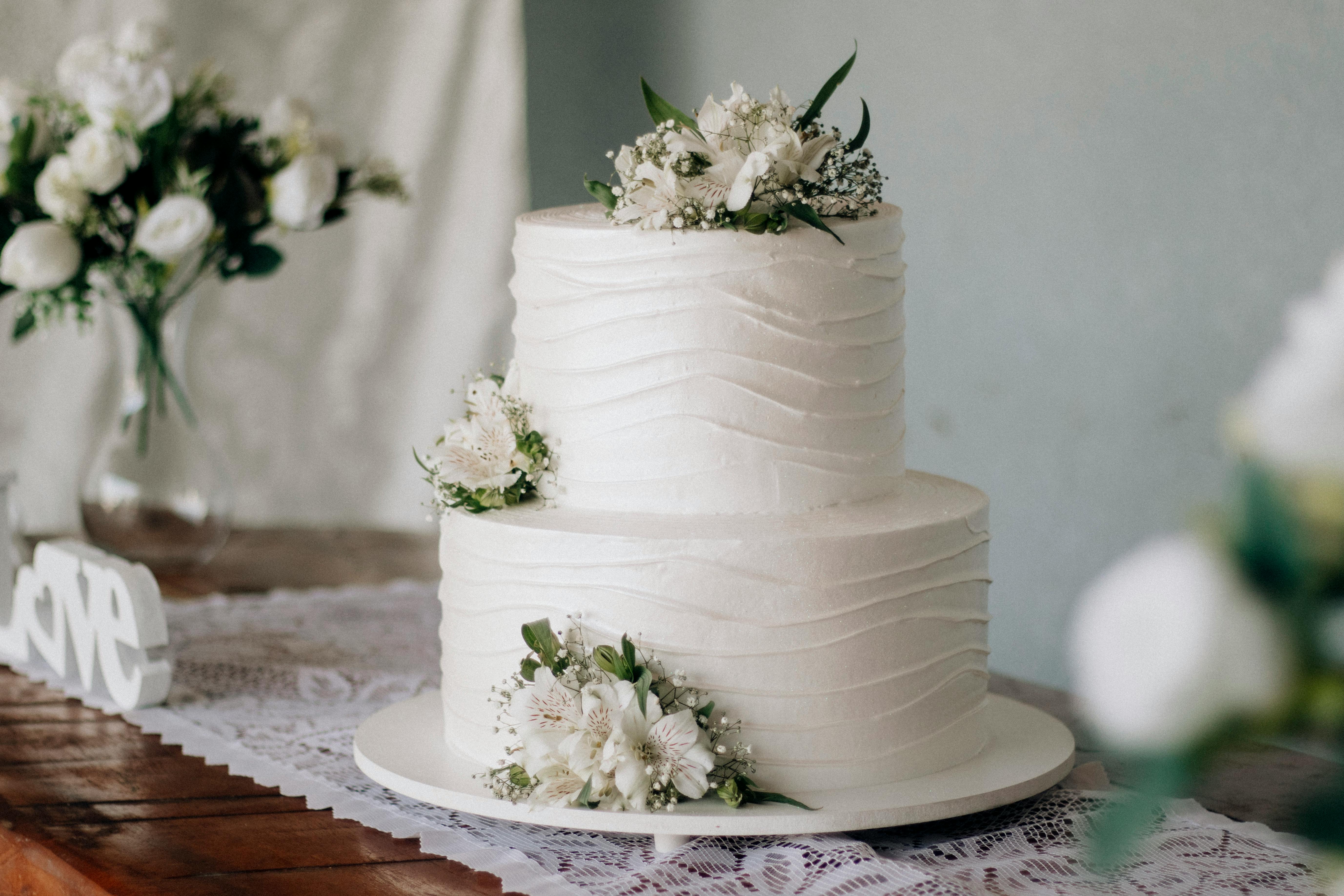 Elegant Two-Tier White Wedding Cake with Flowers