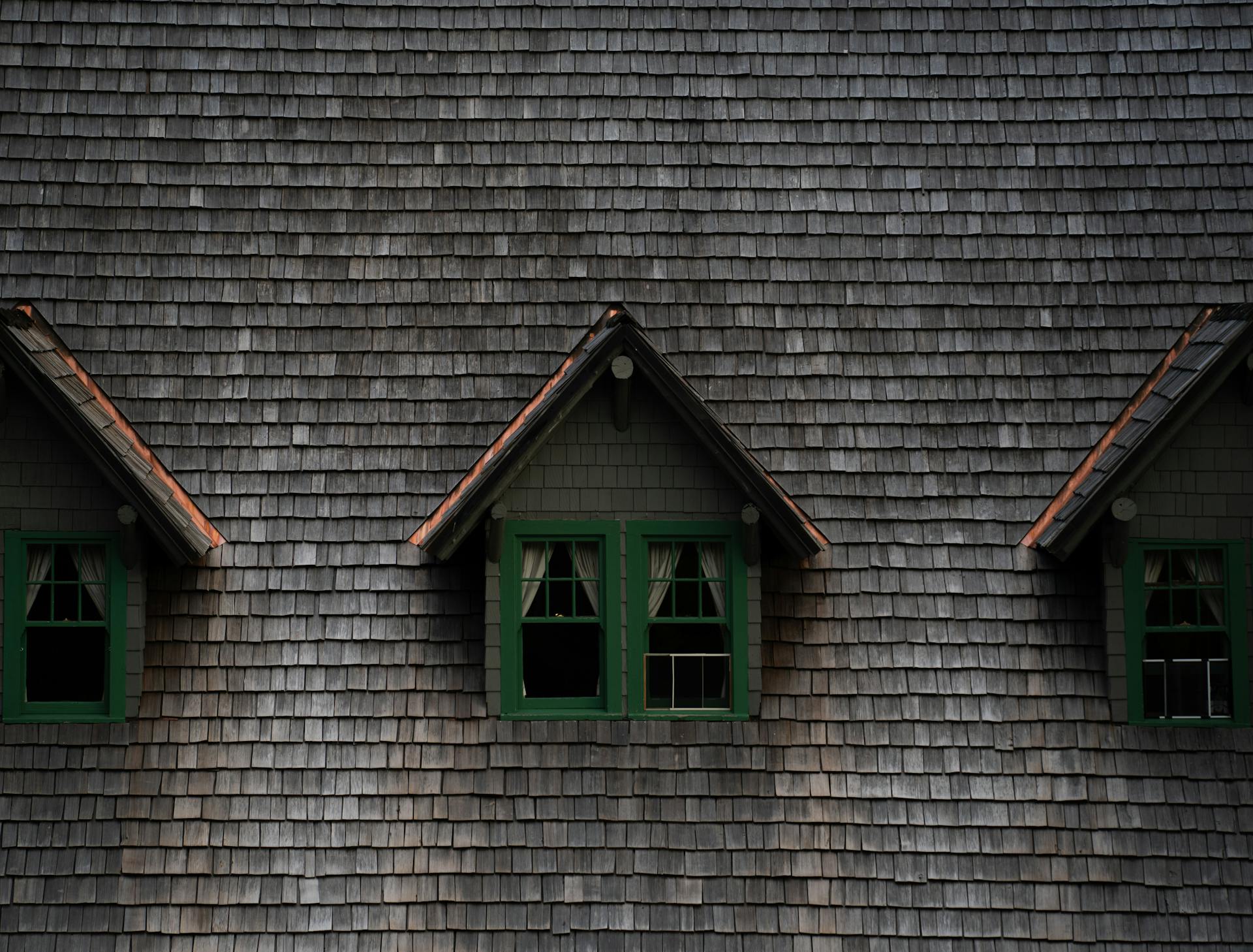 Close-up of a historic building with three charming dormer windows in Washington, USA.