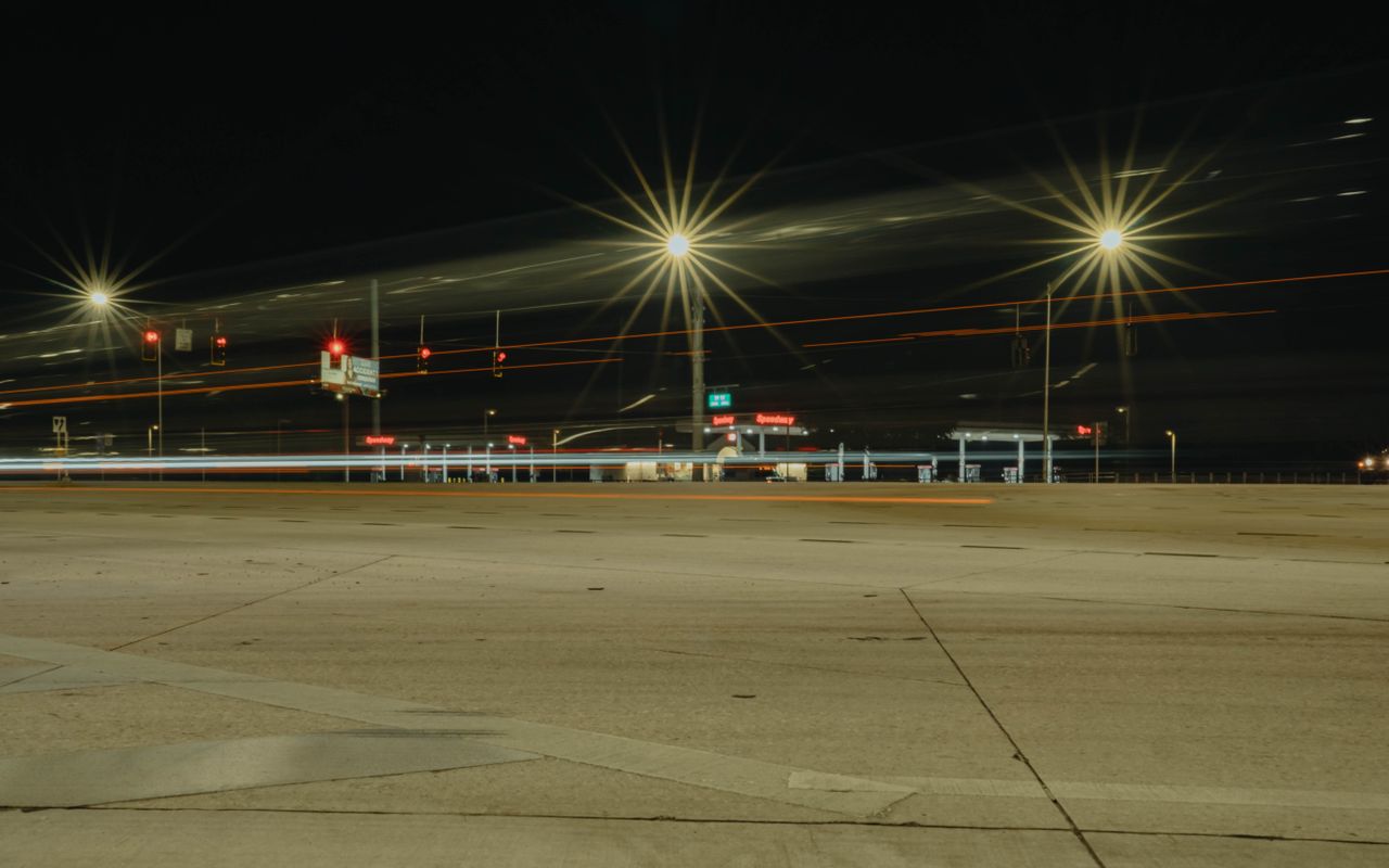 Long exposure of car lights at a Land O' Lakes, Florida intersection at night.
