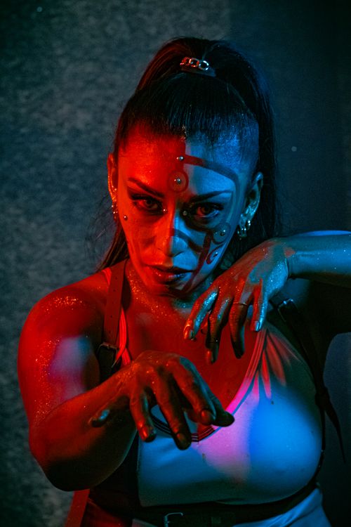Free Intense portrait of a woman with artistic horror makeup under dramatic lighting in Mexico City. Stock Photo