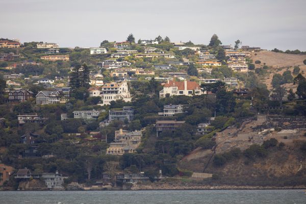 California hillside homes stacked above the water on a clear day