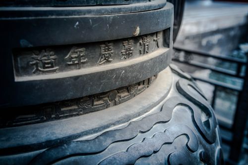 Free Detailed view of historic Chinese stone with intricate carvings and characters. Stock Photo