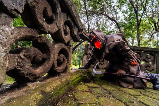 Spooky Halloween cosplay set in a lush Mexican forest with stone ruins.