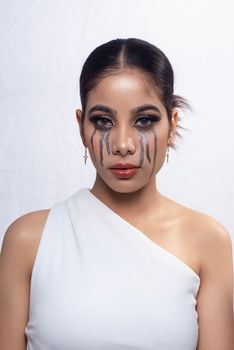 Striking abstract makeup on woman's face for a creative fashion look.