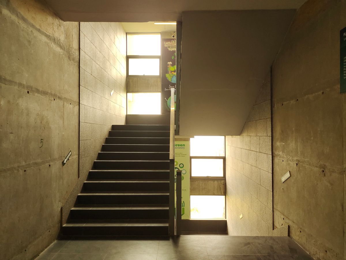 A concrete stair through three floors