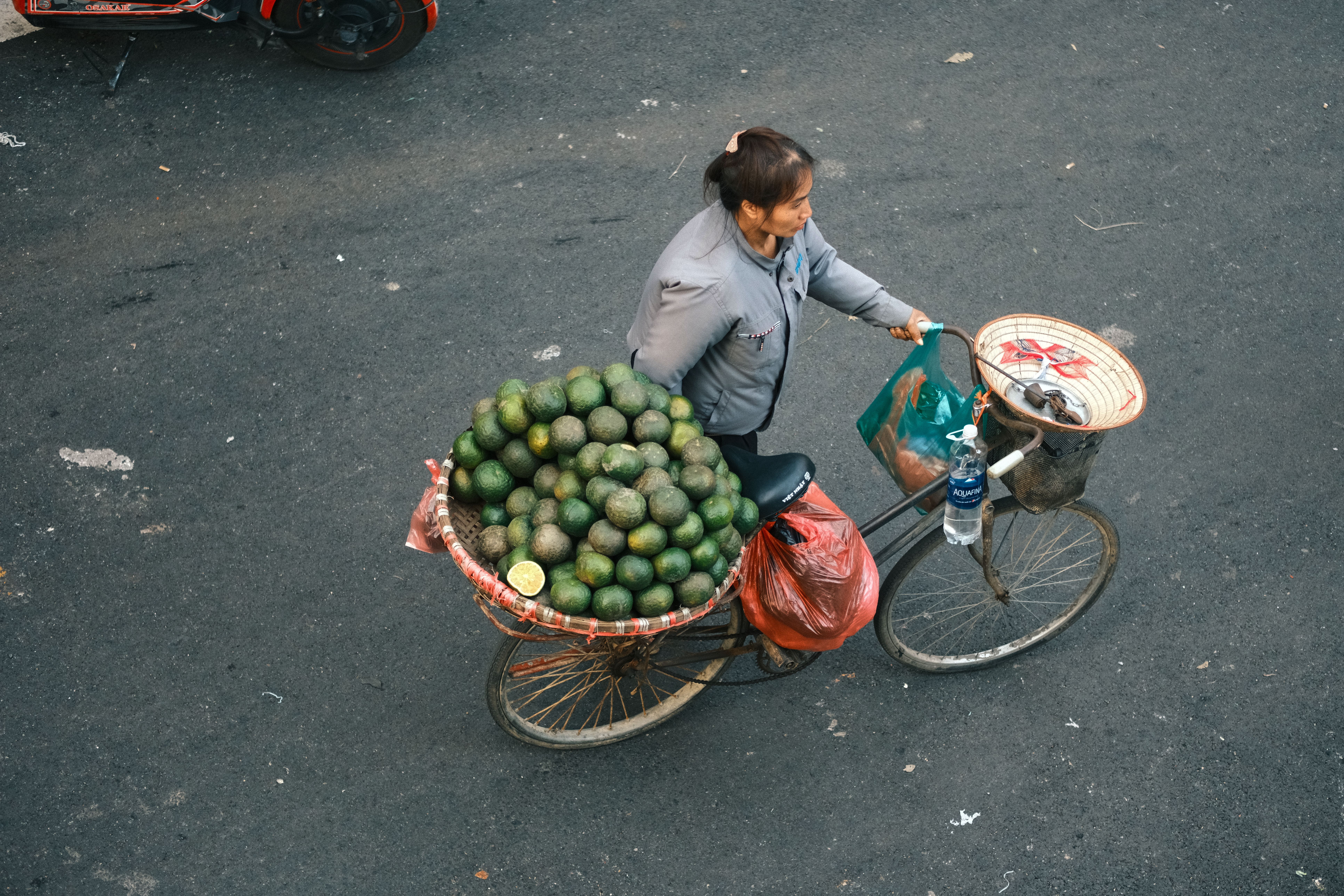 Street Vendor Cycling with Avocado Load · Free Stock Photo