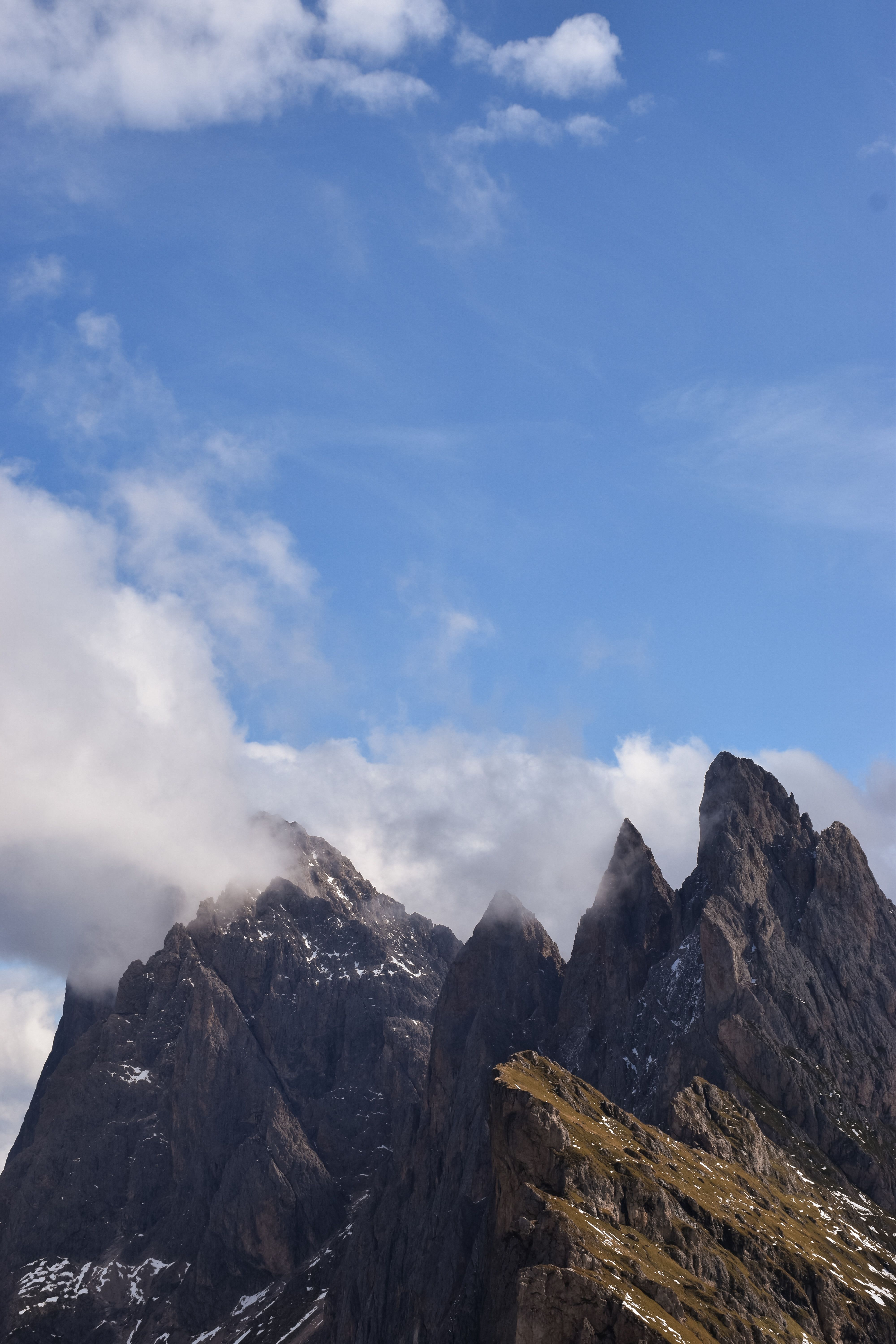 Breathtaking view of the rugged Dolomite peaks under a clear blue sky in Trentino-South Tyrol, Italy.