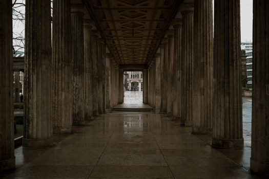 Capture of historic Berlin columns featuring moody tones in a cityscape setting.