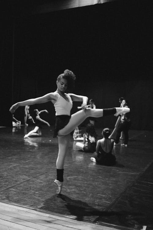 Grayscale Photo of Woman Dancing