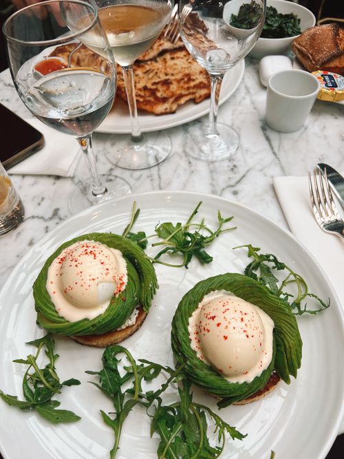 Free Scrumptious avocado toast with poached eggs, perfect for brunch lovers. Stock Photo