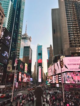 Dynamic view of Times Square displaying vibrant billboards and bustling crowds in New York City.