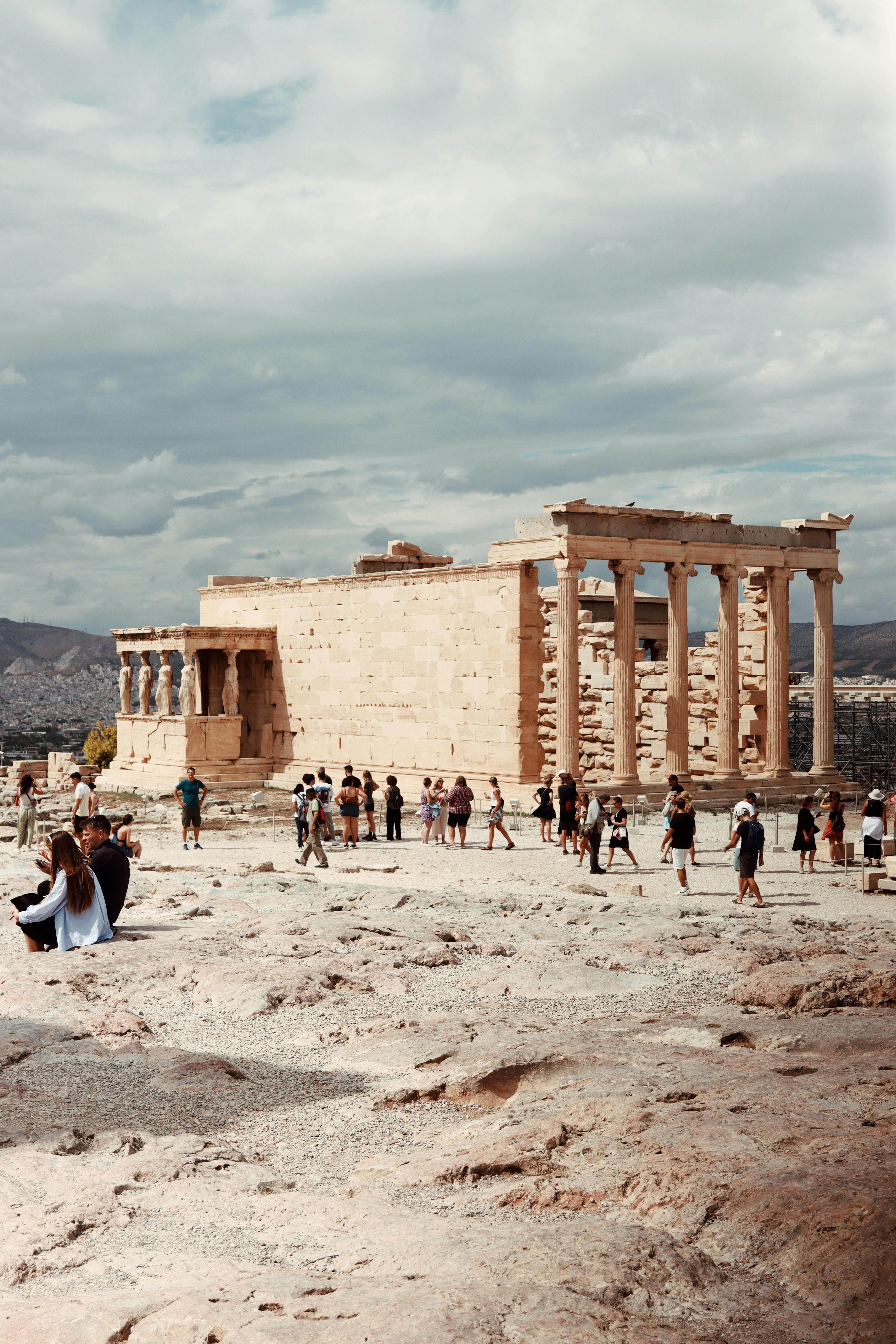 acropolis of athens with visitors and ancient ruins