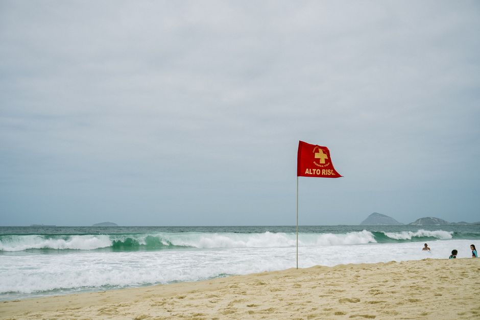 Red warning flag symbol representing scam detection and fraud prevention signals