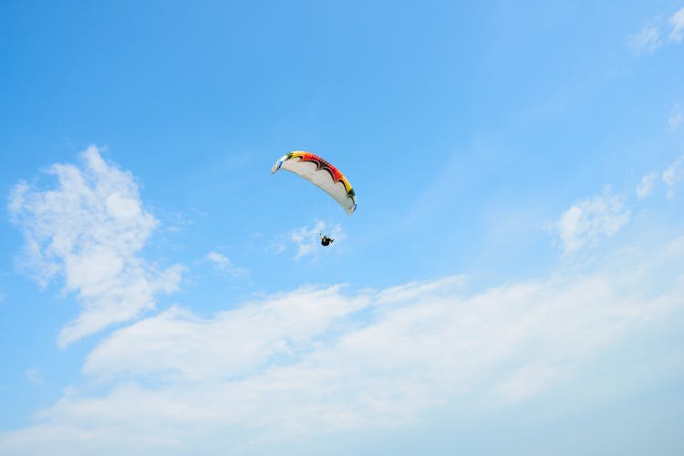Person Parachuting On Mid Air
