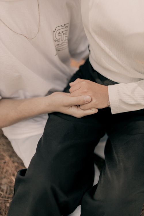 Free Close-up of a couple holding hands, symbolizing love and connection. Stock Photo